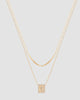 Colar duplo banhado a ouro 18k com corrente cartier, corrente grumet e pingente placa quadrada com crucifixo e microzircônias — semijoia feminina Papoula