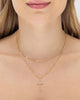 Colar duplo feminino banhado a ouro 18k com corrente satélite e pingente crucifixo cravejado de microzircônias — semijoia religiosa Papoula