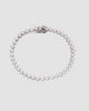 pulseira riviera prateada com zircônia Papoula, semijoia com zircônias brilhantes, 17cm de comprimento, fecho de segurança em caixa, acabamento polido brilhante, antialérgica, fotografada em fundo cinza neutro