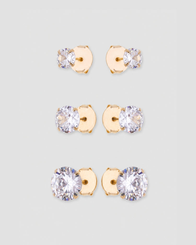 Trio brinco ponto de luz zircônia com base dourada em três tamanhos: 1 cm, 0,7 cm e 0,5 cm — semijoia feminina Papoula