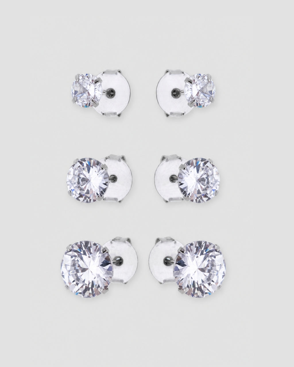 Trio brinco ponto de luz zircônia banho de ródio em três tamanhos: 1 cm, 0,7 cm e 0,5 cm — semijoia feminina Papoula